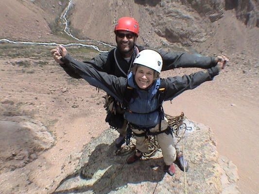 Happy couple at the top of a mountain