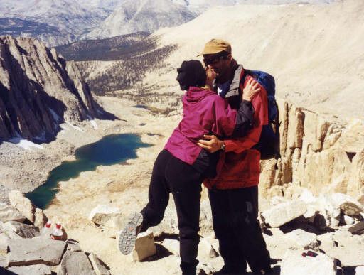 Couple kissing on a mountain